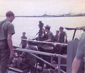 SEAL team boarding USS Weiss at Nha Be, Vietnam.